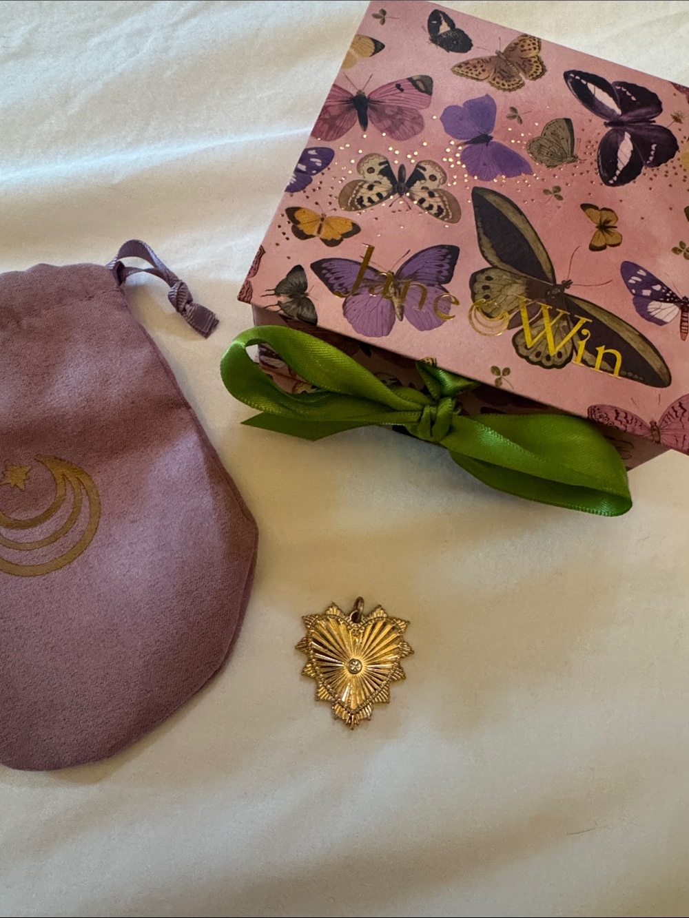 Gold Sunburst Pendant with pink Jane Win bag & Butterfly Box